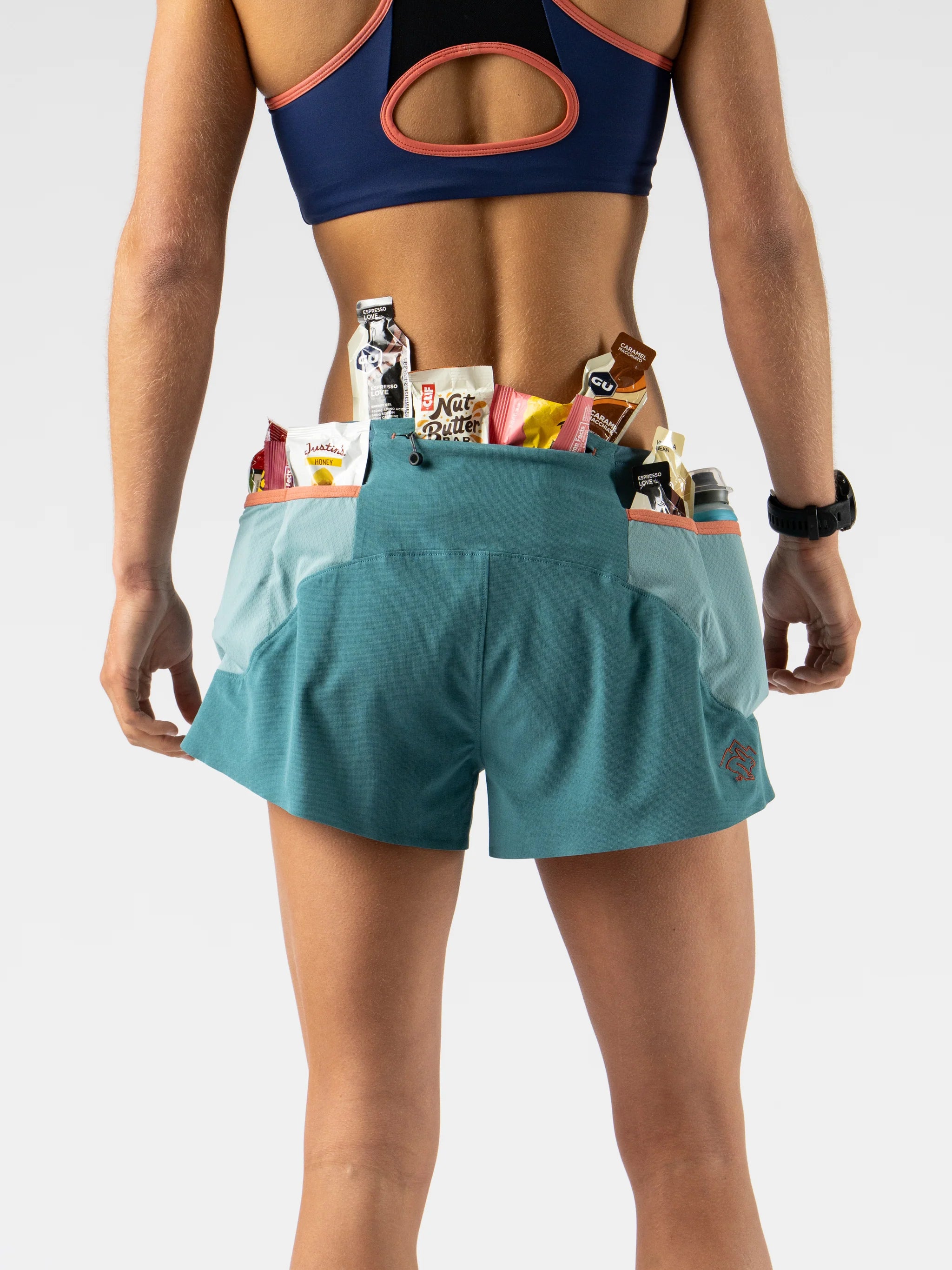 FKT 2.5 - Women by Rabbit in blue and teal trail shorts with technical stretch fabric, lightweight and breathable for running and outdoor use