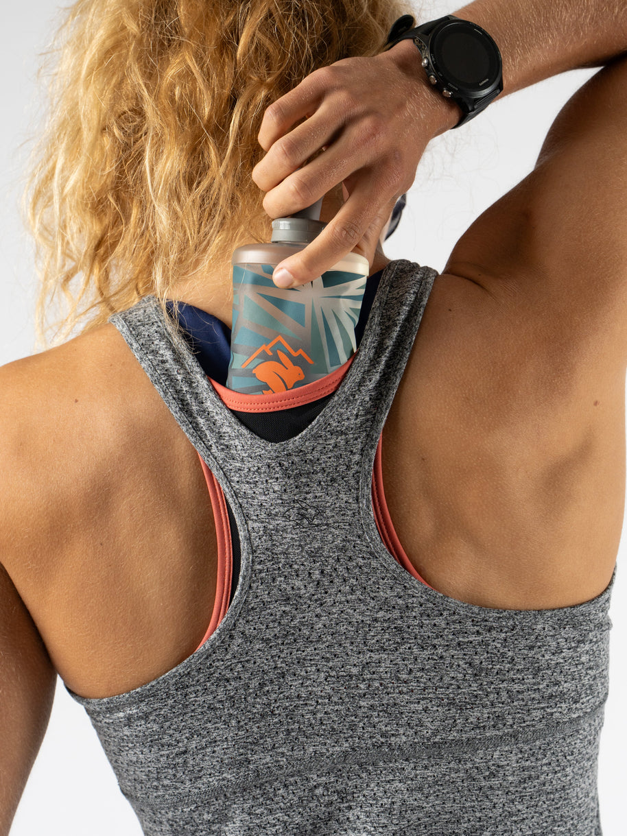 Hydration Trail Tank - Women in grey and coral by Rabbit, lightweight racerback with breathable EZ Perf Trail fabric for long runs