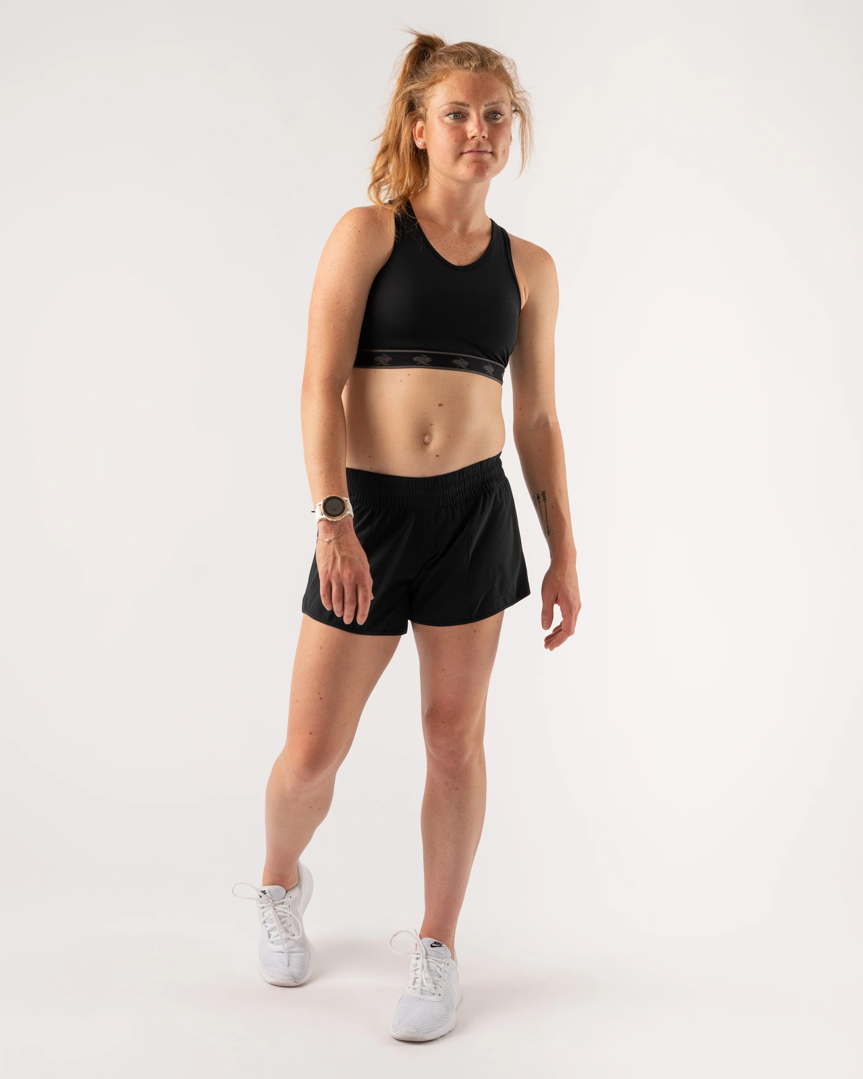 Utili Bra-Vo by Rabbit in black, multifunctional sports bra with laser-cut pocket minimizing bounce for running and outdoor use