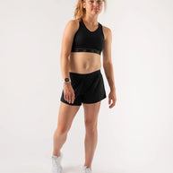 Utili Bra-Vo by Rabbit in black, multifunctional sports bra with laser-cut pocket minimizing bounce for running and outdoor use