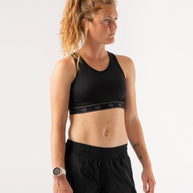 Utili Bra-Vo by Rabbit in black, multifunctional sports bra with laser-cut pocket, minimizing bounce for confident running and active wear.