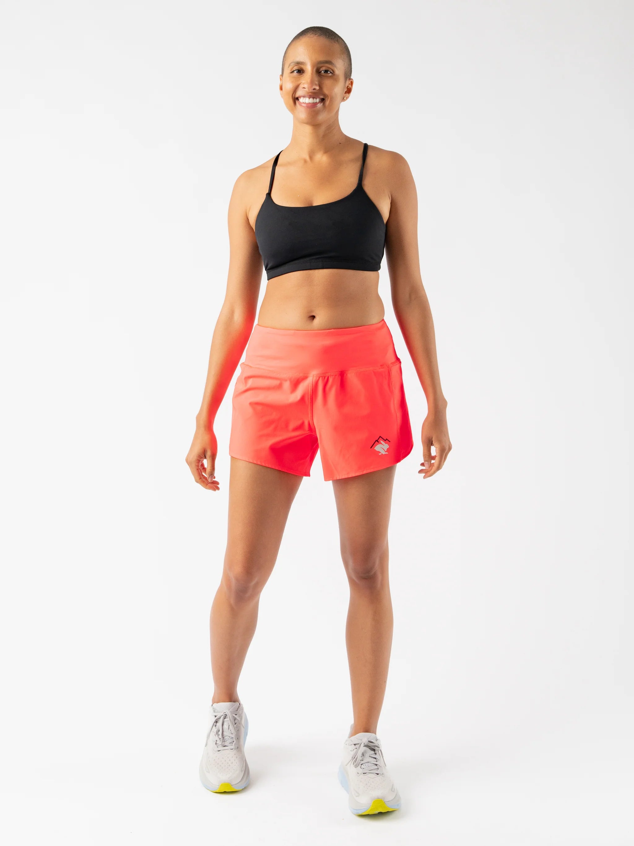 Summit Chasers 4 - Women by Rabbit in bright coral durable stretch diamond ripstop shorts with 5 pockets for running and outdoor use