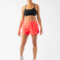 Summit Chasers 4 - Women by Rabbit in bright coral durable stretch diamond ripstop shorts with 5 pockets for running and outdoor use