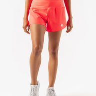 Summit Chasers 4 - Women by Rabbit in coral with five pockets and durable stretch diamond ripstop, ideal for running and outdoor use