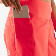 Summit Chasers 4 - Women by Rabbit in bright coral durable stretch diamond ripstop shorts with five pockets including back zip for running and outdoor use