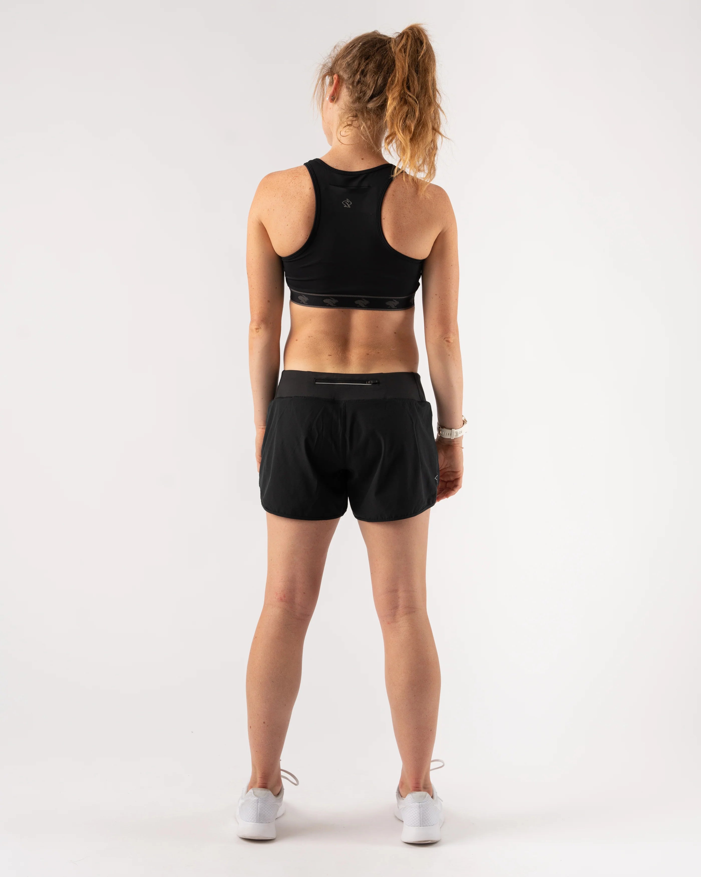 Utili Bra-Vo by Rabbit in black, multifunctional sports bra with laser-cut pocket, minimizes bounce, ideal for women running and activewear