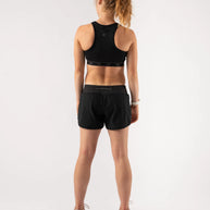 Utili Bra-Vo by Rabbit in black, multifunctional sports bra with laser-cut pocket, minimizes bounce, ideal for women running and activewear