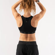 Utili Bra-Vo by Rabbit in black, multifunctional sports bra with laser-cut pocket minimizing bounce for running and outdoor activities