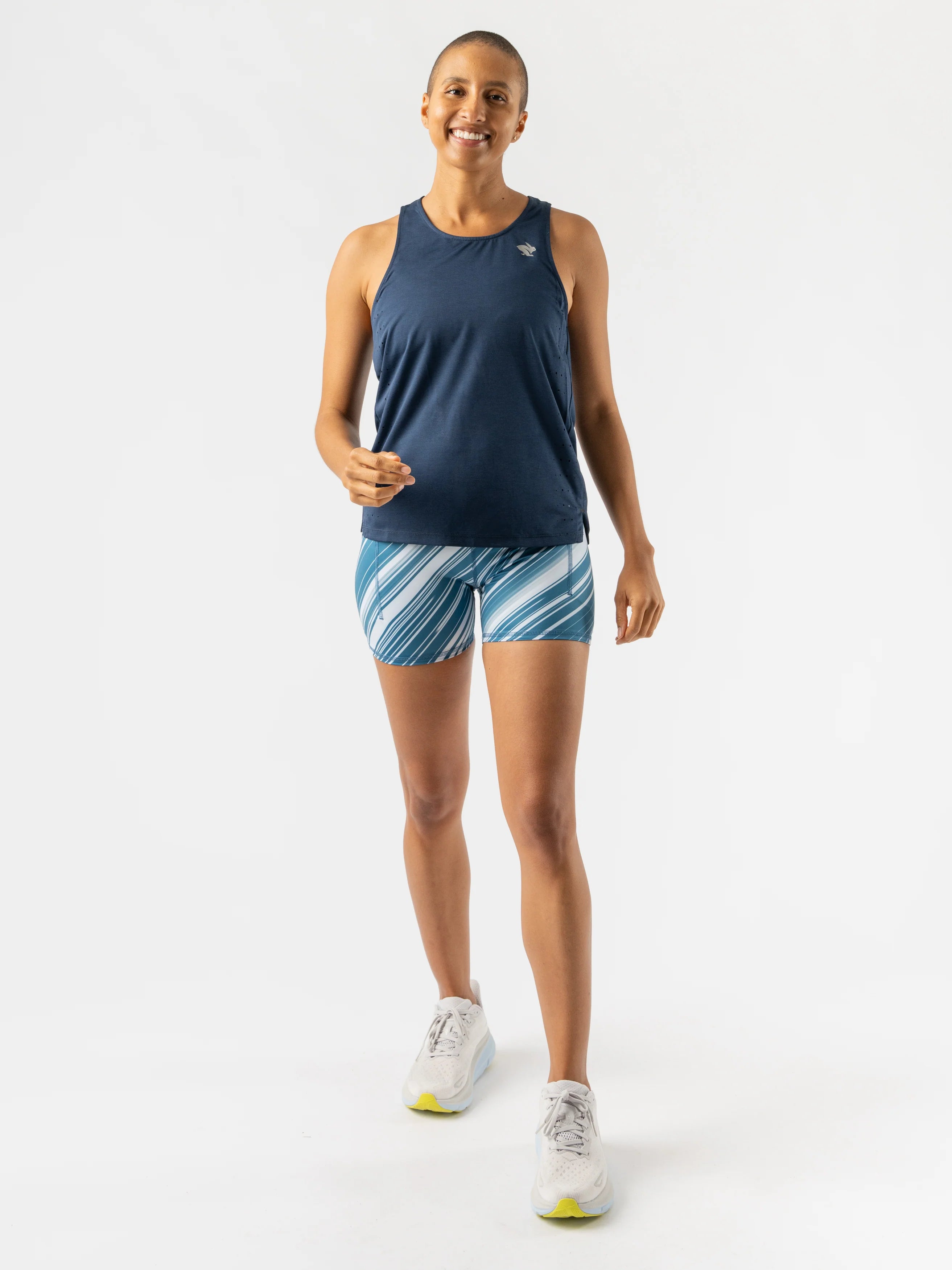 Race Pace Tank - Women by Rabbit in navy blue, breathable tank with laser-cut square perfs for airflow, ideal for running and training