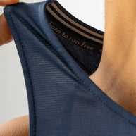 Race Pace Tank - Women by Rabbit in navy with breathable laser-cut perforations and microtextured inside for running comfort and performance