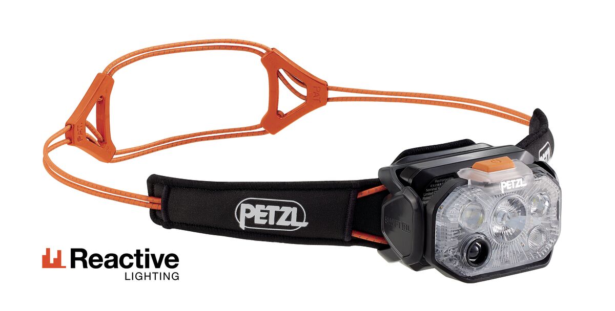 Petzl Swift RL Headlamp with black Petzl headband and orange cords, Reactive Lighting logo