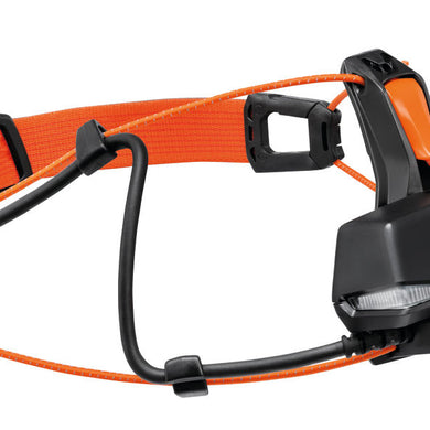 Nao RL Headlamp by Petzl in black and orange, 1500 lumens rechargeable headlamp with adjustable band for ultra-running and trail safety