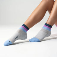 Elite Light Cushion Quarter by Feetures in light grey, blue, purple stripes, anatomical socks with targeted compression for running and active use