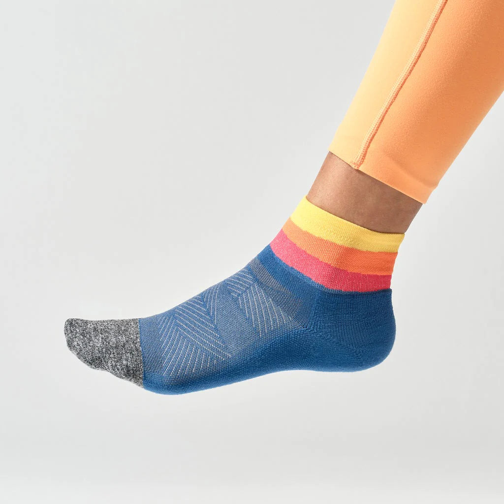 Elite Ultra Light Cushion Quarter by Feetures in blue, yellow, and pink with targeted compression and ultra light cushioning for running comfort