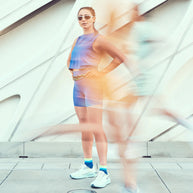Elite Light Cushion Quarter socks by Feetures in blue and lime, anatomically designed for running and outdoor comfort and support