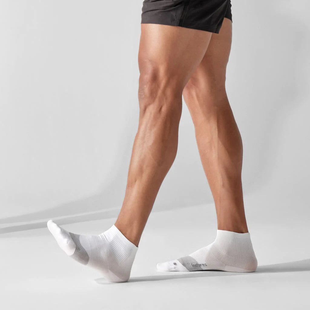 Elite Ultra Light Cushion Quarter by Feetures in white and grey, ultra light cushioned socks with targeted compression for running and support