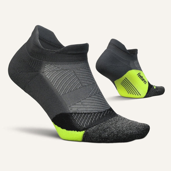 Elite Light Cushion No Show Tab by Feetures in black and neon yellow, anatomically designed running socks with targeted compression for extra comfort and support