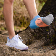 Elite Light Cushion No Show Tab by Feetures in blue and grey, anatomical light cushion socks designed for running and outdoor movement