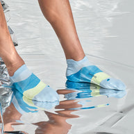 Elite Ultra Light Cushion No Show Tab by Feetures in blue and yellow with anatomical design and targeted compression for blister prevention and running