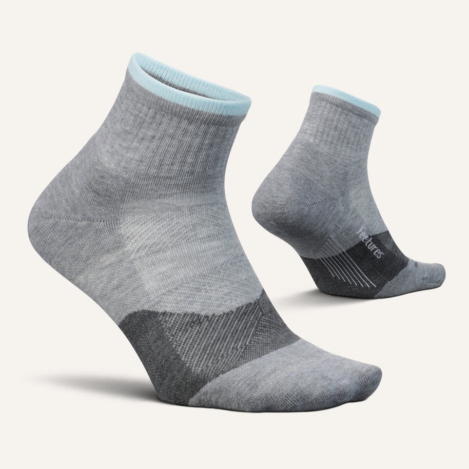 Pair of Feetures Trail Max Cushion Quarter Socks in Light Grey, side and back views