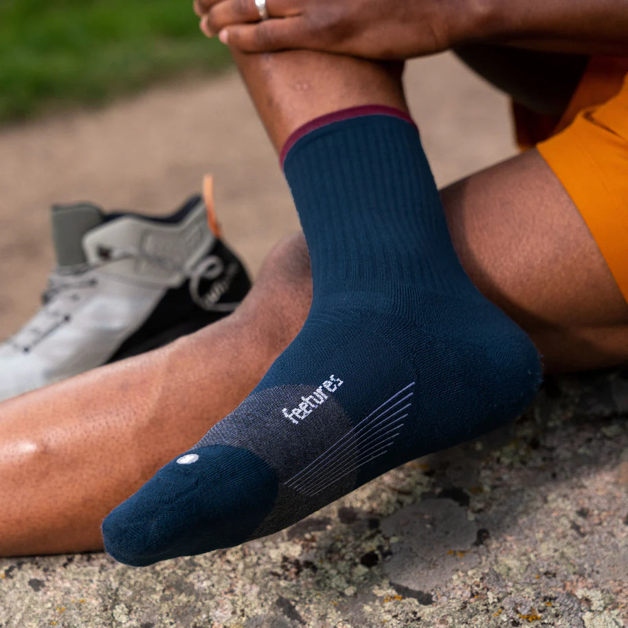 Trail Max Cushion Mini-Crew by Feetures in blue with maroon cuff, cushioned anatomical sock with targeted compression for hiking and trail running