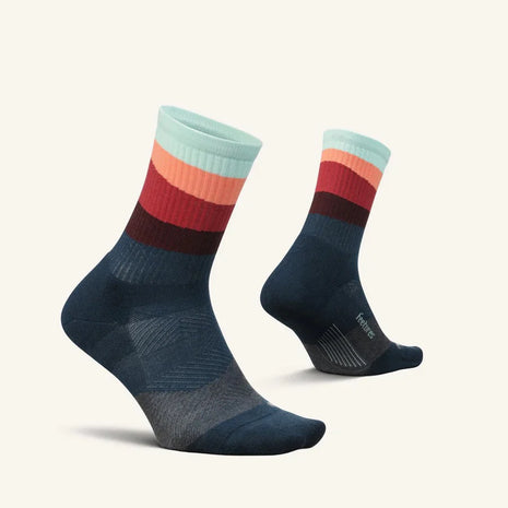 Trail Max Cushion Mini-Crew by Feetures in blue, red, peach, and teal with targeted compression for hiking and trail running