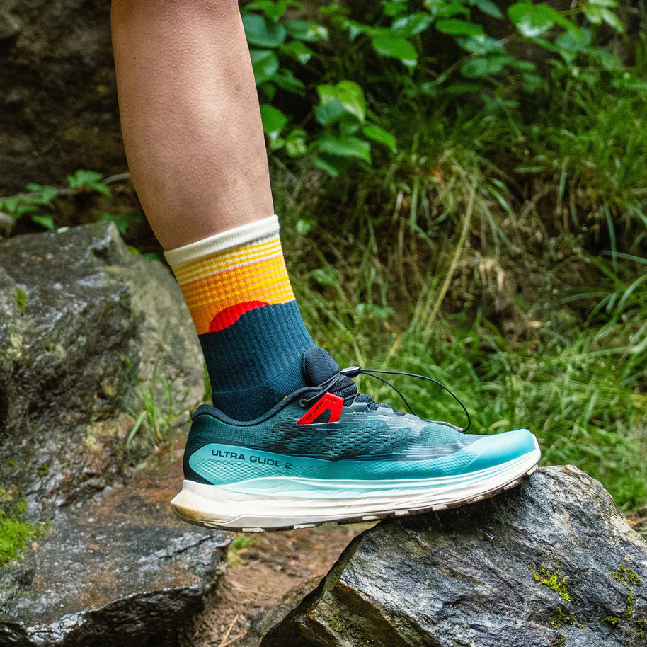Trail Max Cushion Mini-Crew by Feetures in blue and orange with anatomical design and targeted compression for hiking and trail running