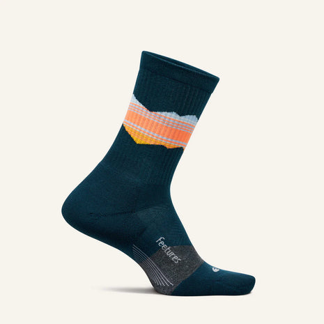 Trail Max Cushion Mini-Crew by Feetures in dark blue with orange, white, and yellow stripes, cushioned socks with anatomical fit for hiking and trail running