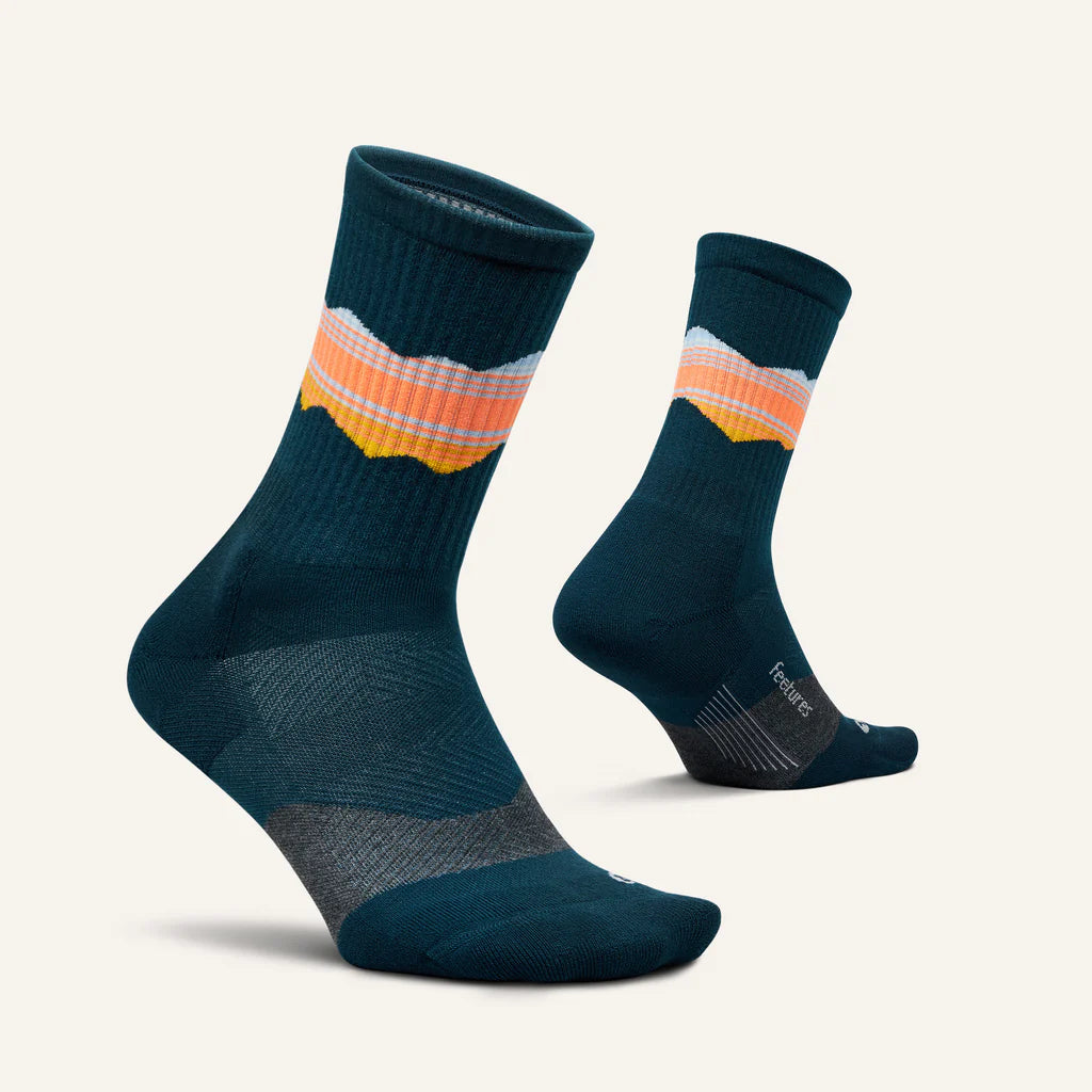 Trail Max Cushion Mini-Crew by Feetures in dark blue with orange and pink stripes, cushioned socks with anatomical design for hiking and trail running