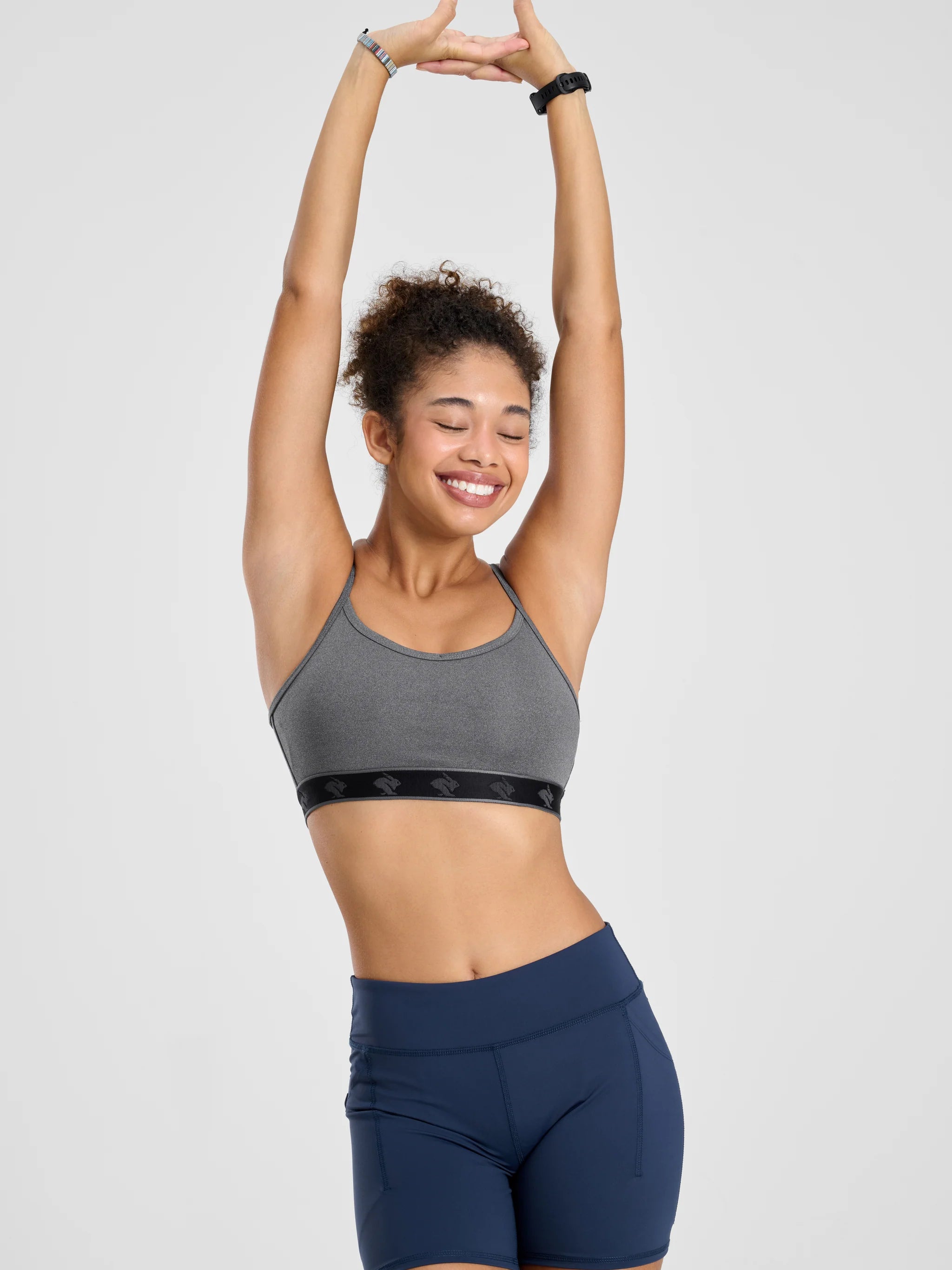 Strappy Pocket Bra - Women by Rabbit in grey with black band, built-in pocket, minimal bounce, comfortable for active use