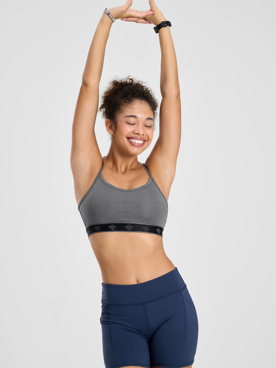 Strappy Pocket Bra - Women by Rabbit in grey with black band, built-in pocket, minimal bounce, comfortable for active use