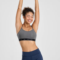 Strappy Pocket Bra - Women by Rabbit in grey with black band, built-in pocket, minimal bounce, comfortable for active use