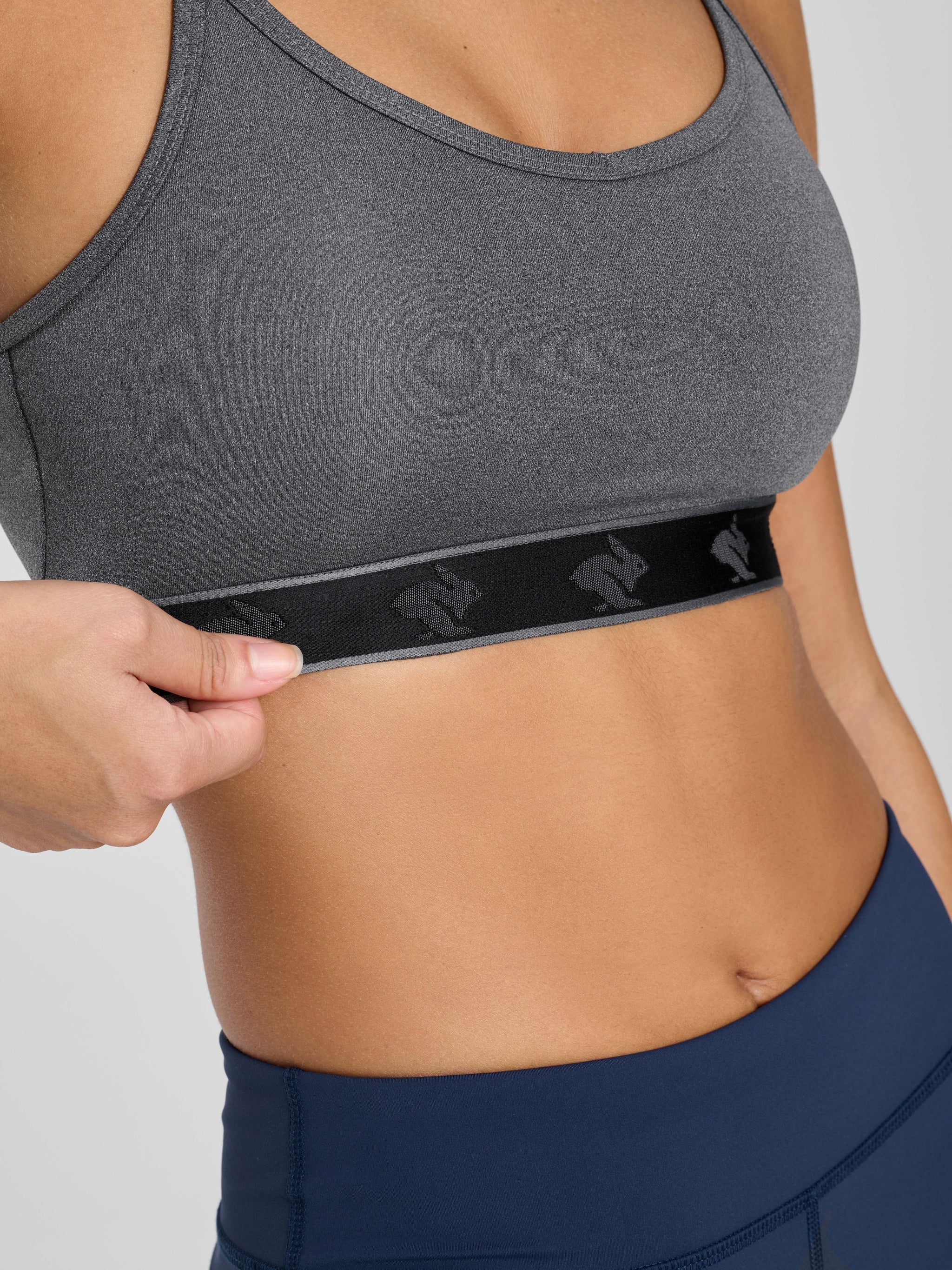 Strappy Pocket Bra - Women by Rabbit in dark grey with black band, built-in pocket, minimal bounce, comfortable for active wear