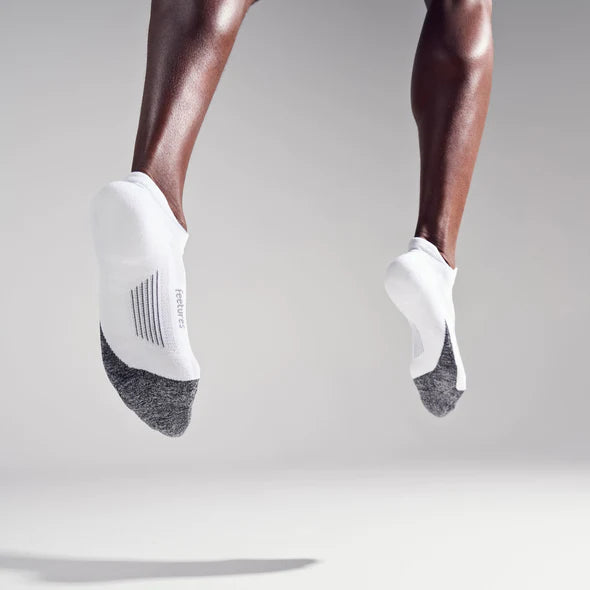 Elite Light Cushion No Show Tab by Feetures in white and grey, anatomical running socks with targeted compression for performance and comfort