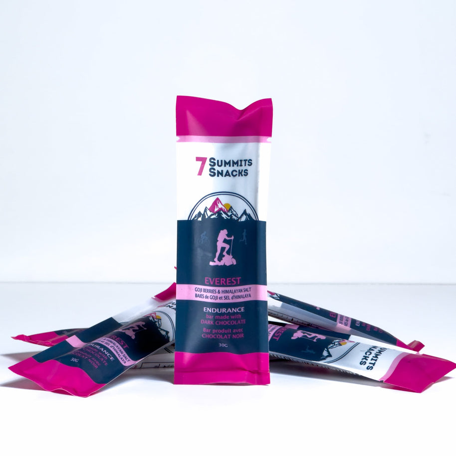 Everest Dark Chocolate Endurance Bar (30g) by 7 Summit Snacks in pink and black with 64% Peruvian dark chocolate, honey, and electrolytes for endurance