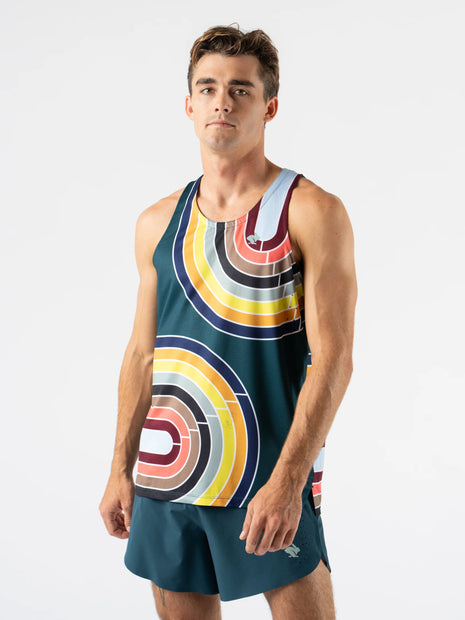 Race Pace Tank - Men by Rabbit in teal with multicolor circular pattern, breathable semi-relaxed tank with laser-cut ventilation for running.