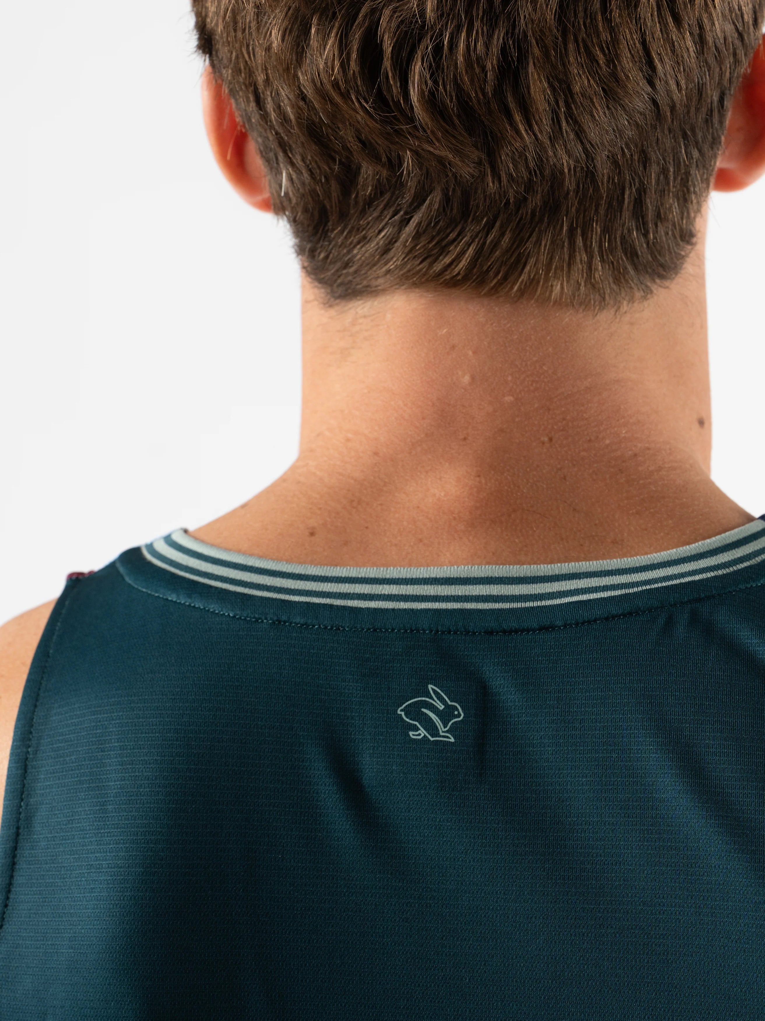 Race Pace Tank - Men by Rabbit in dark blue with breathable laser-cut square perfs and microtextured inside for running comfort