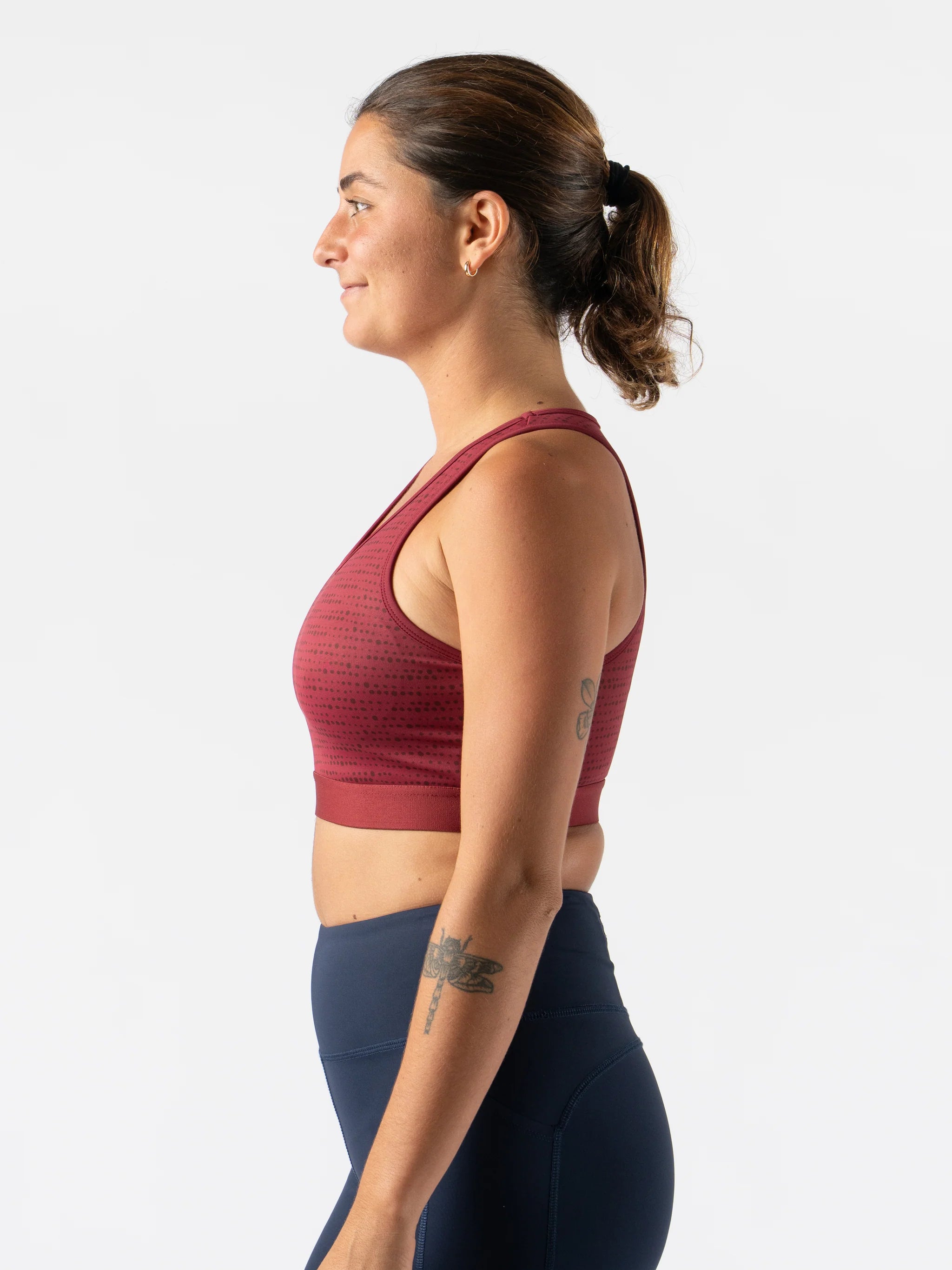 Utili Bra-Vo by Rabbit in burgundy, multifunctional sports bra with laser-cut pocket for essentials, minimizes bounce for running and active use