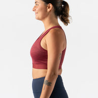 Utili Bra-Vo by Rabbit in burgundy, multifunctional sports bra with laser-cut pocket for essentials, minimizes bounce for running and active use