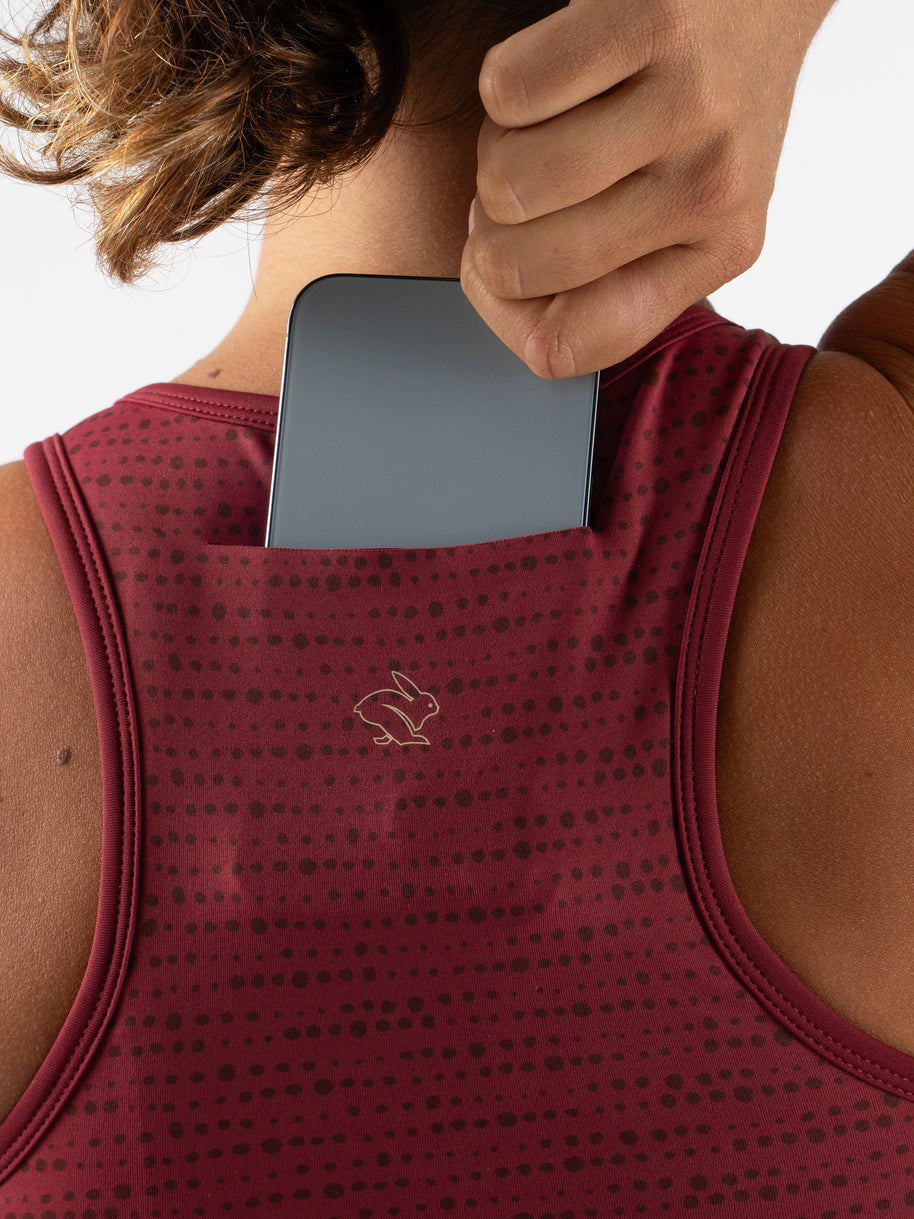 Utili Bra-Vo by Rabbit in dark red with laser-cut pocket for phone, multifunctional sports bra minimizing bounce for running and fitness