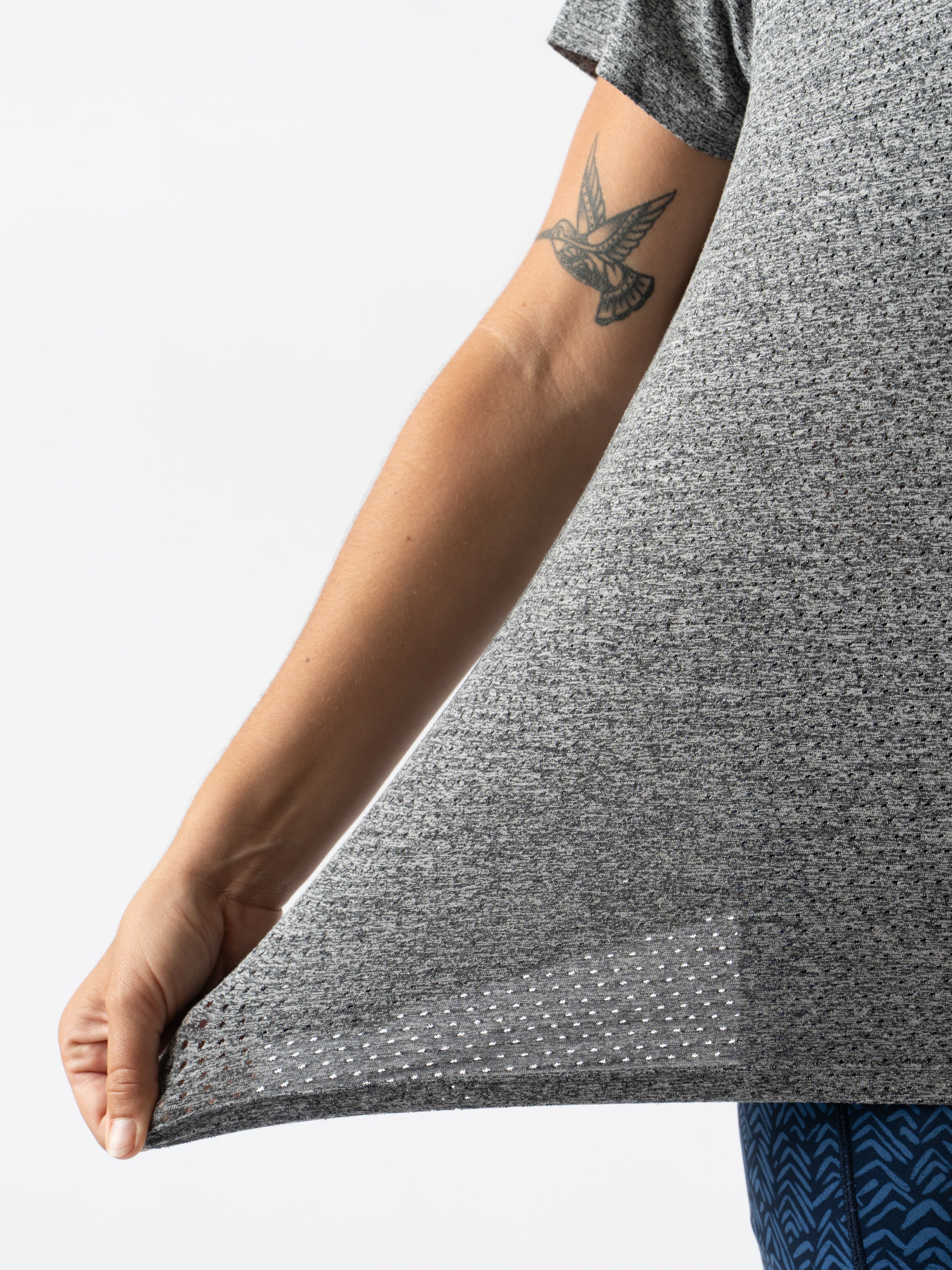 EZ Tee Perf SS Trail - Women by Rabbit in grey, lightweight breathable trail running top with perforations for enhanced ventilation