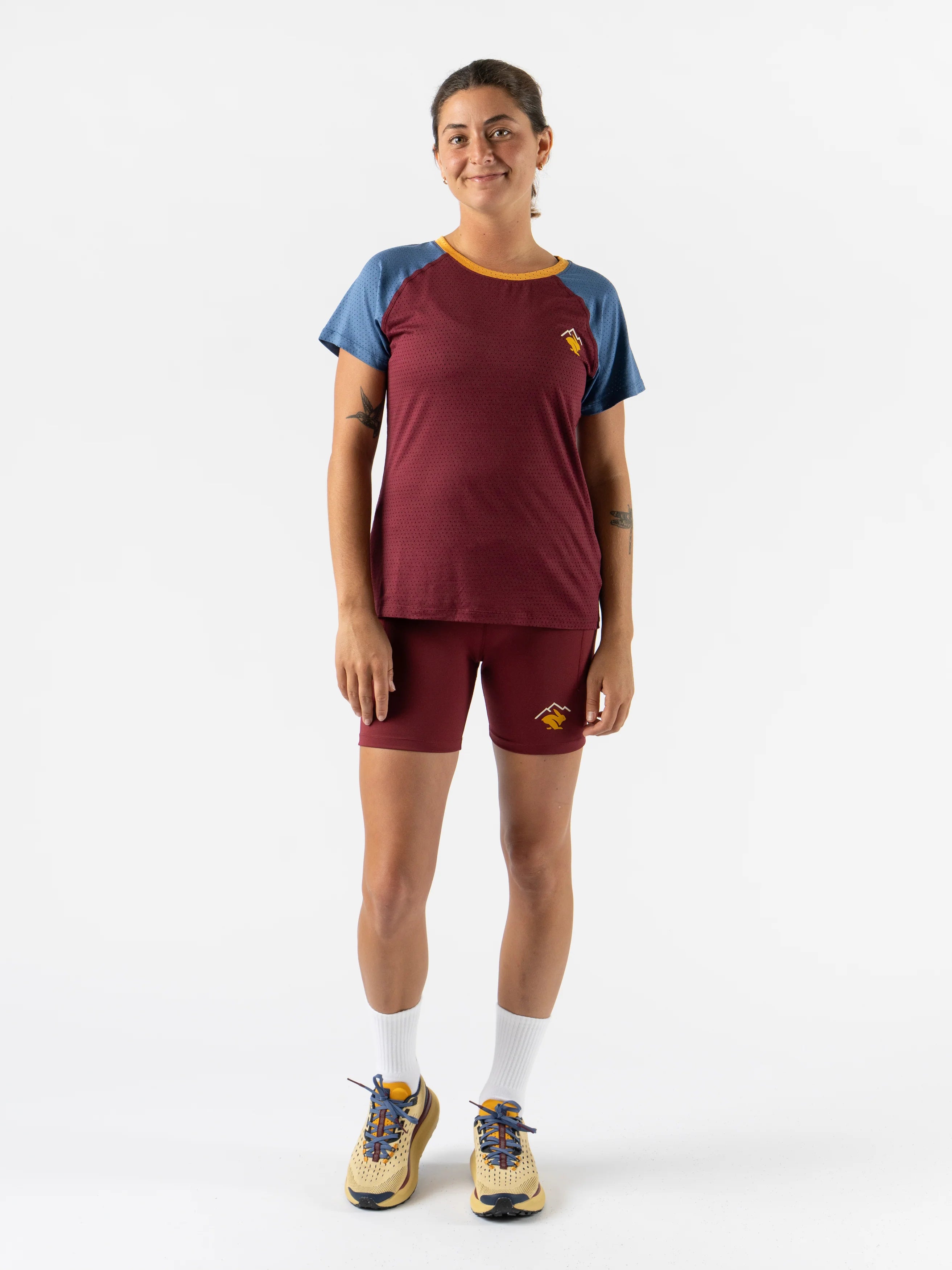 EZ Tee Perf SS Trail - Women by Rabbit in burgundy and blue, lightweight breathable running top with perforations designed for trail running comfort
