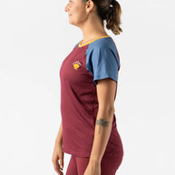 EZ Tee Perf SS Trail - Women by Rabbit in maroon and blue with breathable perforations, lightweight soft trail running top ideal for outdoor use