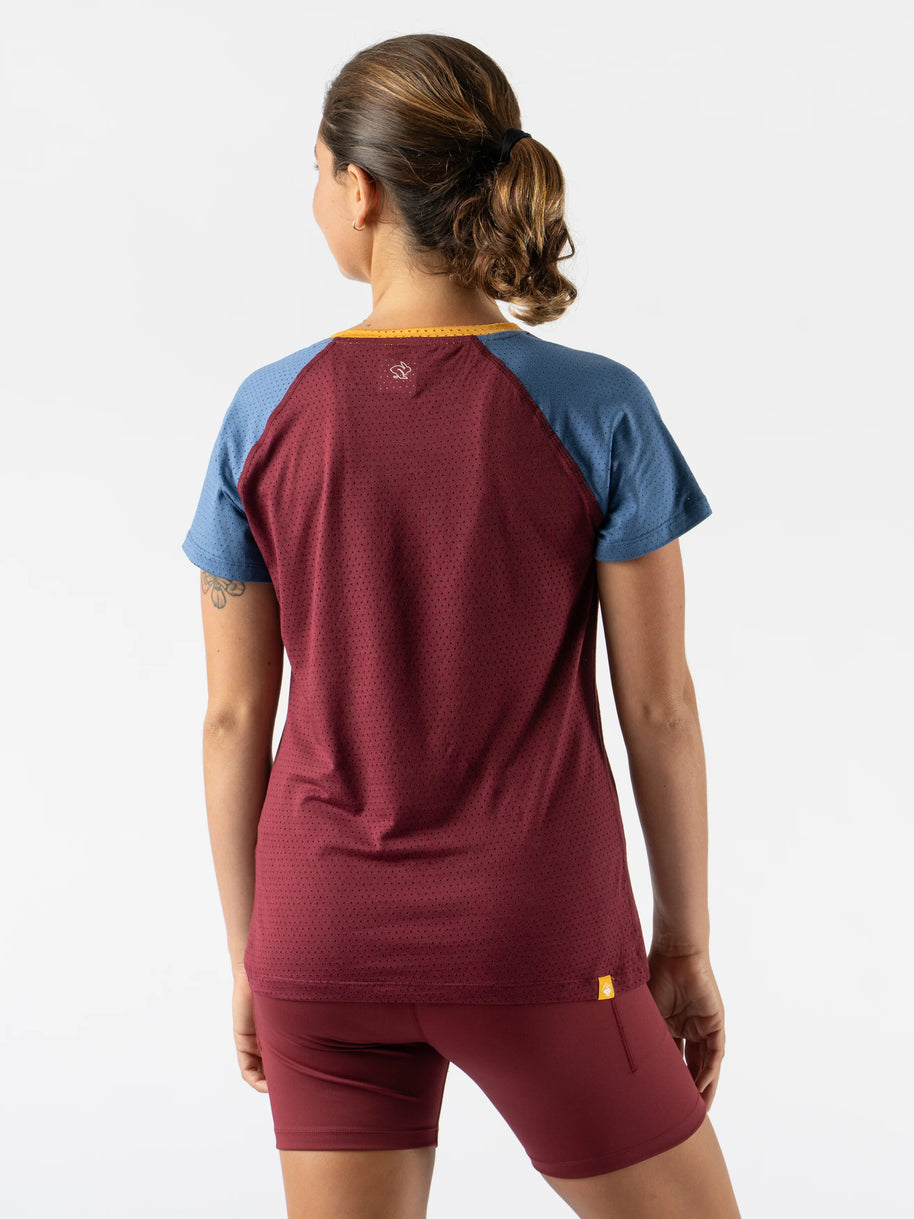 EZ Tee Perf SS Trail - Women by Rabbit in burgundy and blue, lightweight breathable perforated running tee ideal for trail running and outdoor use