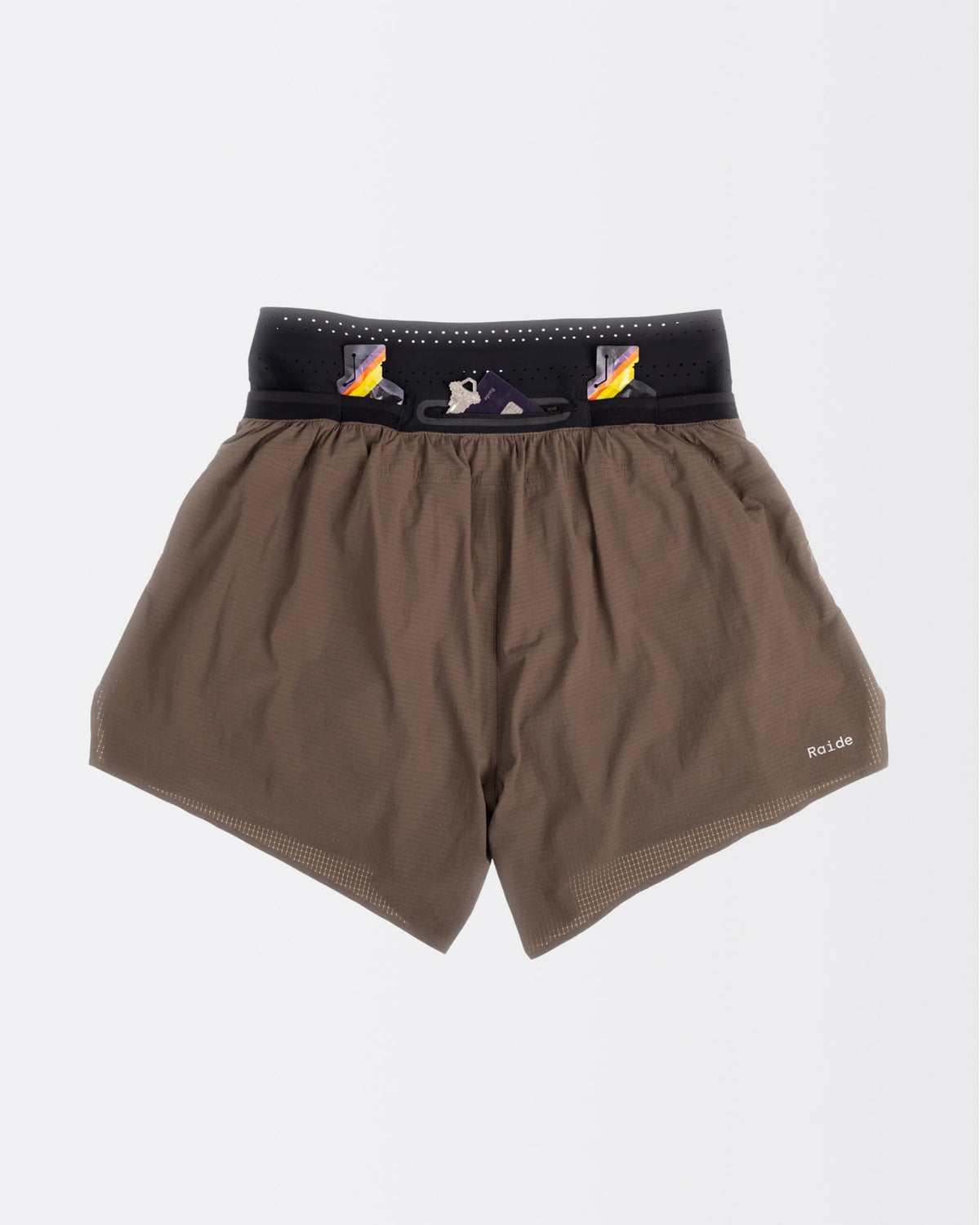 Back view of the Raide Research Trail Tech Short men's 5 inch in Bark with gels stashed in the waistband pockets