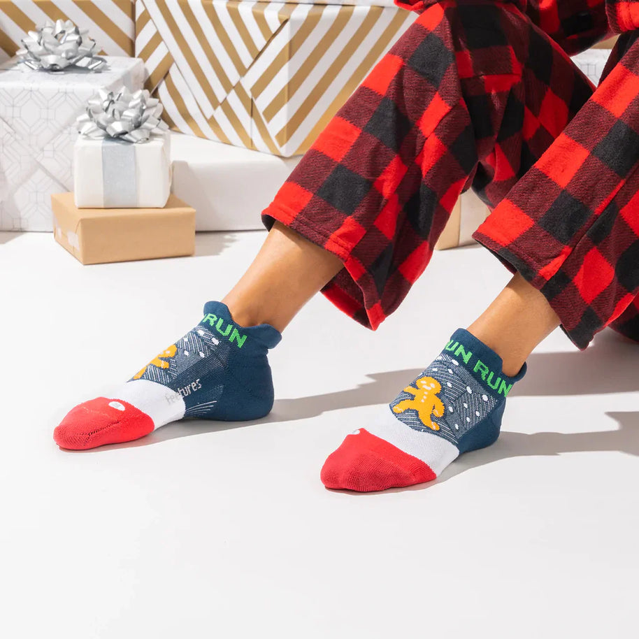 Elite Light Cushion No Show Tab by Feetures in navy, red, and white with anatomical design and targeted comp for comfortable running and movement