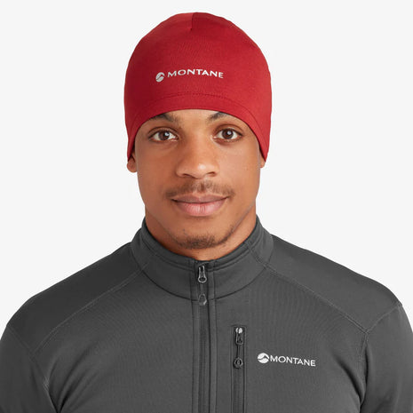 Dart XT Beanie by Montane in red, lightweight breathable cold weather headwear with moisture management for outdoor use