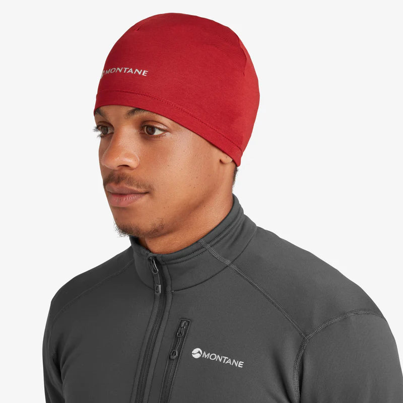 Dart XT Beanie by Montane in red, lightweight breathable headwear with moisture management for cold weather running and outdoor use