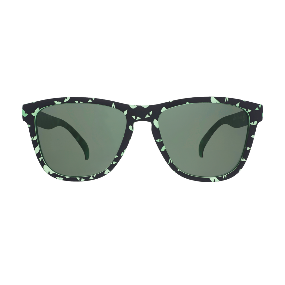 Front view of the Goodr What Lurks In The Shadows sunglasses with black and green speckled frames