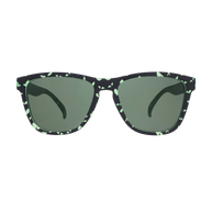 Front view of the Goodr What Lurks In The Shadows sunglasses with black and green speckled frames